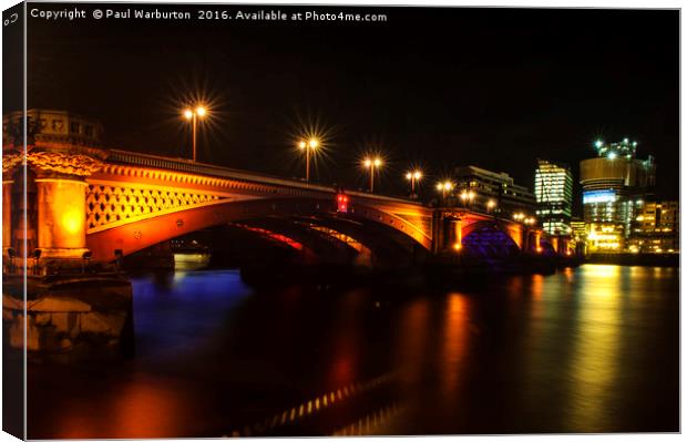 Blackfriars Bridge Illuminated in Orange Canvas Print by Paul Warburton