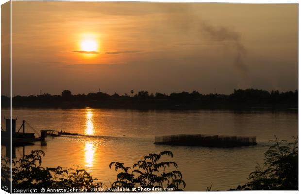 Sunset on the Mekong River Canvas Print by Annette Johnson