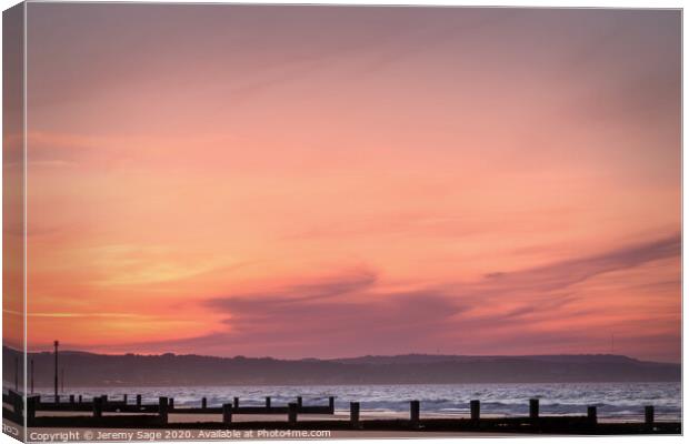 A Glowing Sunrise on Dymchurch Beach Canvas Print by Jeremy Sage