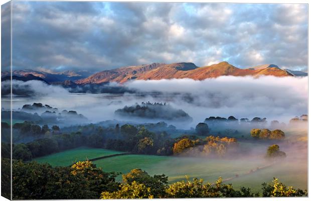 Mists over Derwentwater and Catbells Canvas Print by Martin Lawrence