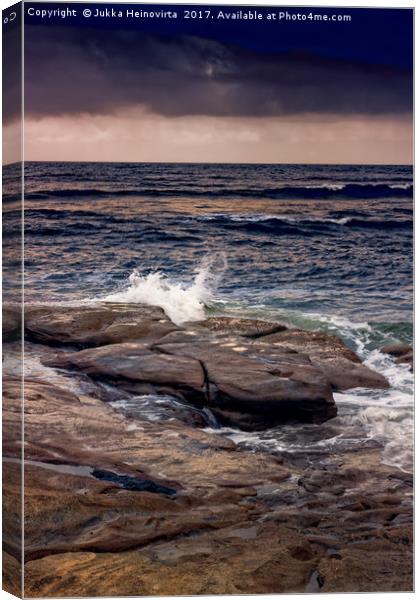 Waves Splash On The Rocks At Sunset Canvas Print by Jukka Heinovirta