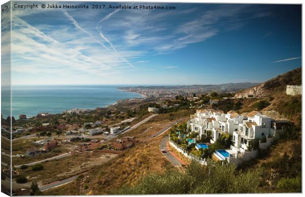 White Houses On The Mountainside Canvas Print by Jukka Heinovirta