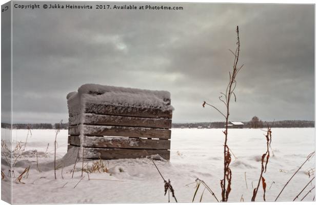 Snow Covered Wooden Crate On The Fields Canvas Print by Jukka Heinovirta
