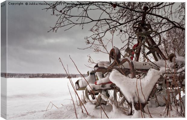 Snow Covered Farming Equipment Canvas Print by Jukka Heinovirta