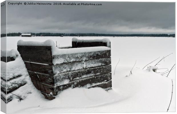 Frozen Crates Covered With Snow Canvas Print by Jukka Heinovirta