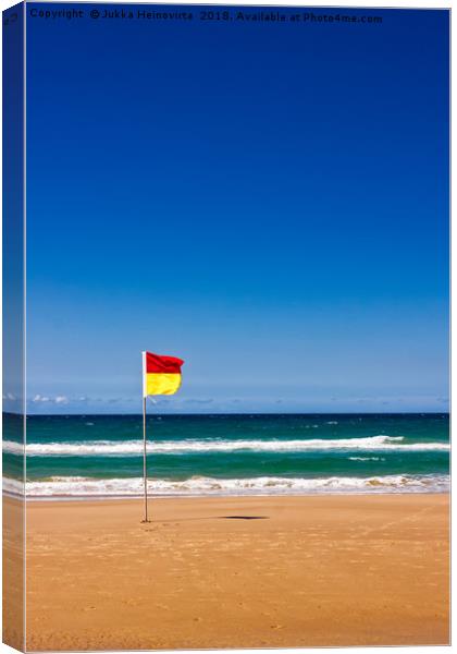 Lonely Life Saver Flag On Australian Beach Canvas Print by Jukka Heinovirta