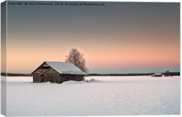 Lonely Barns On The Snowy Fields Canvas Print by Jukka Heinovirta