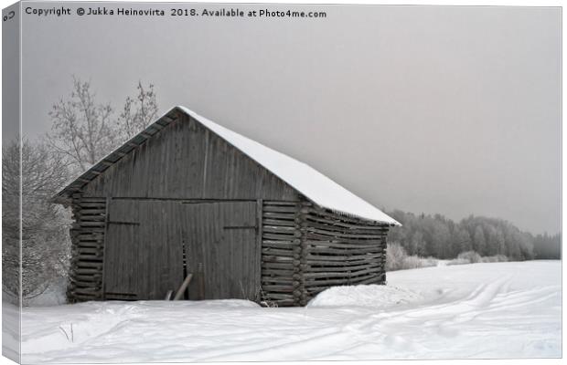 Old Barn With Wide Doors By The Snowy Field Canvas Print by Jukka Heinovirta