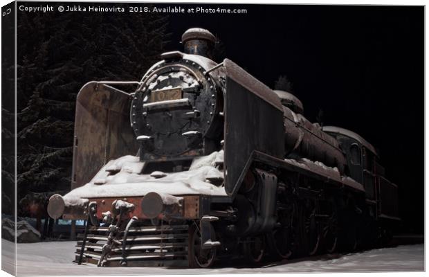 Old Steam Engine Covered With Snow Canvas Print by Jukka Heinovirta