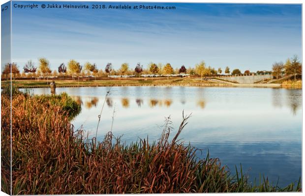 Fisherman By The Lake Canvas Print by Jukka Heinovirta