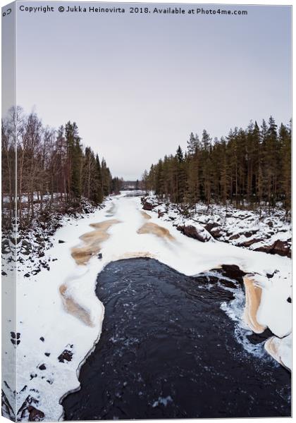 Waves In The Freezing River Canvas Print by Jukka Heinovirta