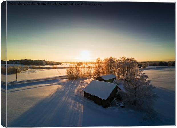 Farm Houses In The Winter Sunset Canvas Print by Jukka Heinovirta
