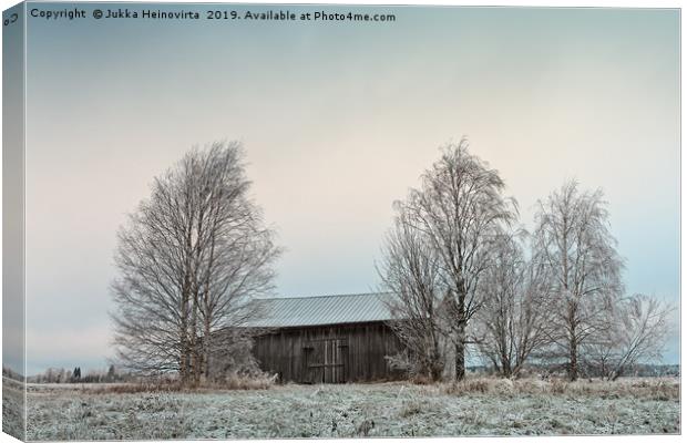Old Wooden Barn Surrounded By Trees Canvas Print by Jukka Heinovirta