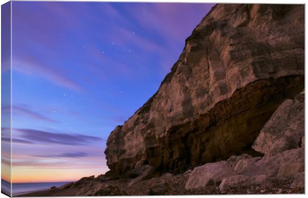 Hunstanton cliffs under the stars  Canvas Print by Simon Blatch
