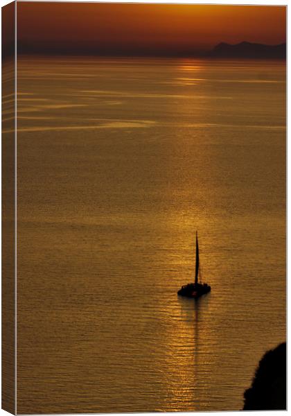 Boat in the Sunset at Oia Canvas Print by Jeremy Hayden