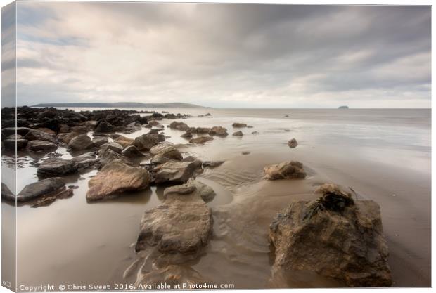 Rocks and Sand Canvas Print by Chris Sweet