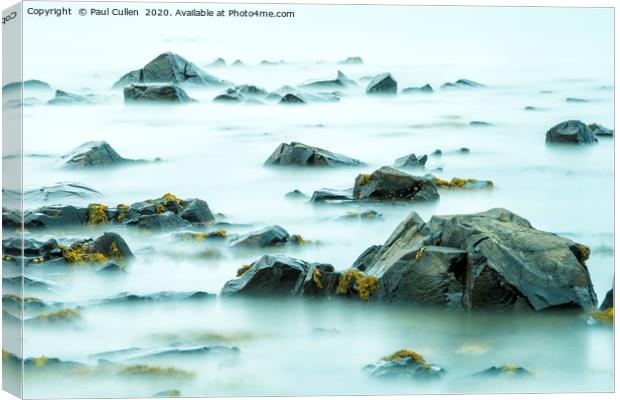 The Rocks and the Sea Canvas Print by Paul Cullen