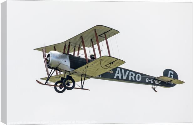 Avro 504K flies past in a cloudy sky Canvas Print by Steve de Roeck