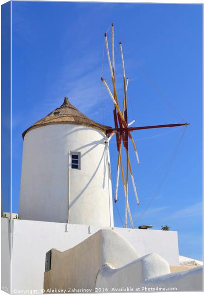 A windmill in Santorini island, Greece Canvas Print by Aleksey Zaharinov