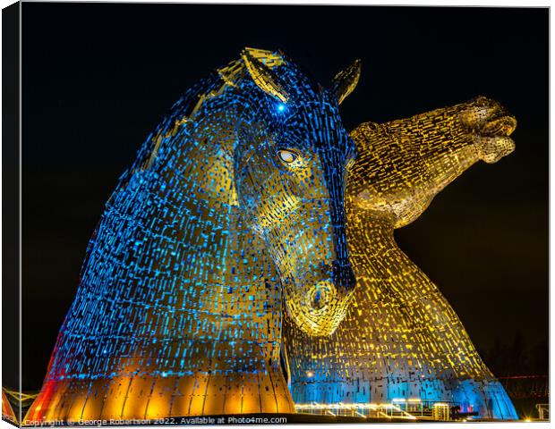The Kelpies in support of Ukraine are light up in blue and yello Canvas Print by George Robertson