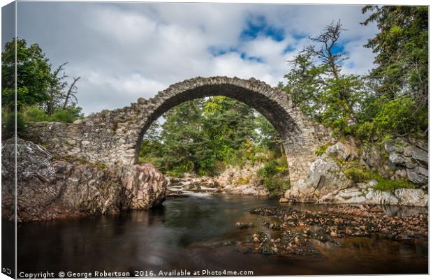 Old stone bridge in the village of Carrbridge Canvas Print by George Robertson