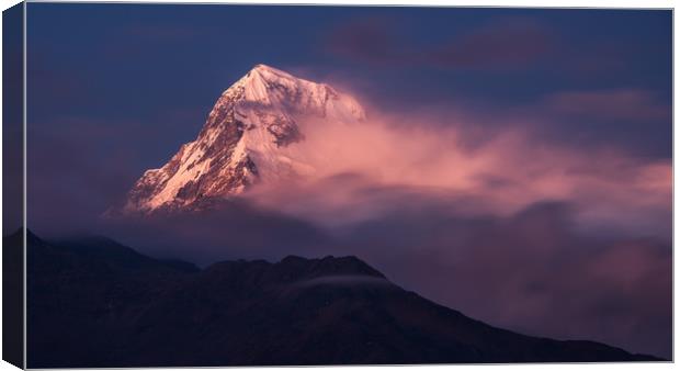 Clouds clearing on Annapurna South Canvas Print by George Robertson