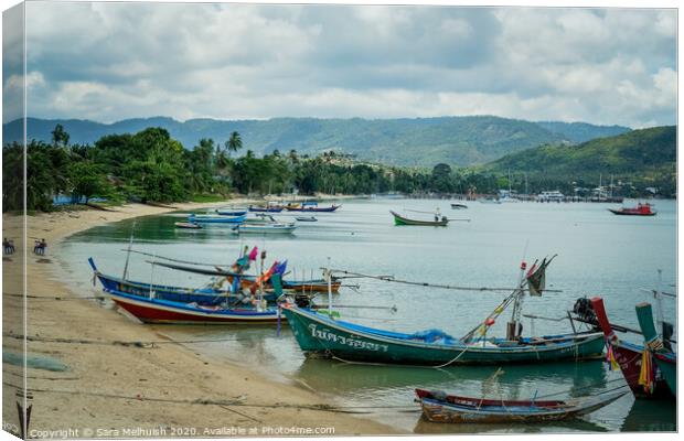 Moored longboats Canvas Print by Sara Melhuish