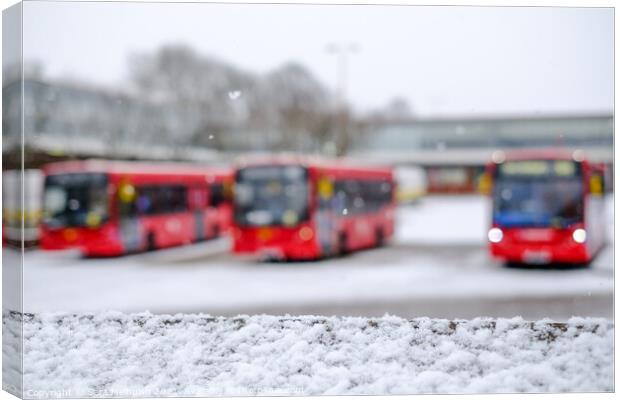 A trio of London buses in the snow Canvas Print by Sara Melhuish