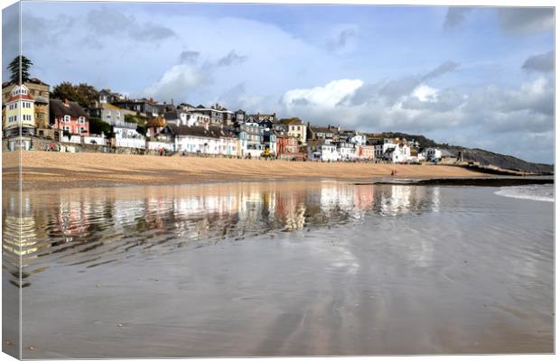 Lyme Regis reflected in the sand and sea Canvas Print by Lynn Carter