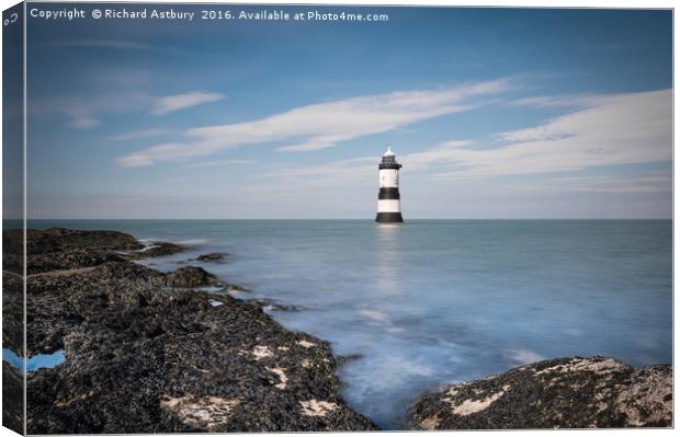 Penmon Lighthouse Canvas Print by Richard Astbury