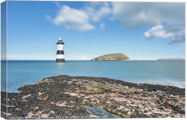 Penmon Lighthouse Canvas Print by Richard Astbury