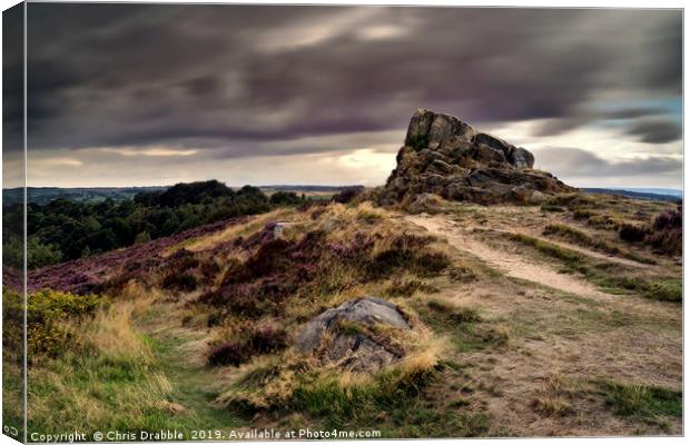 Ashover Stone and moving clouds Canvas Print by Chris Drabble
