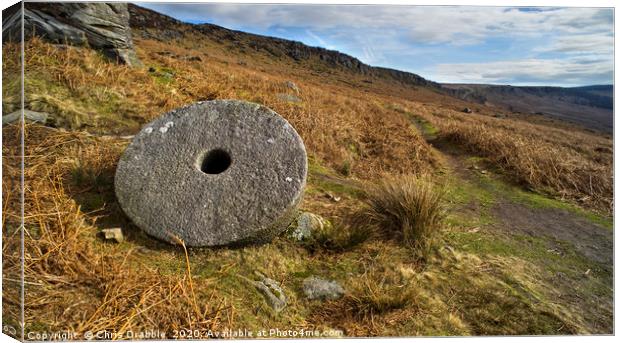 Abandoned Mill Stone, under Stanage Edge Canvas Print by Chris Drabble