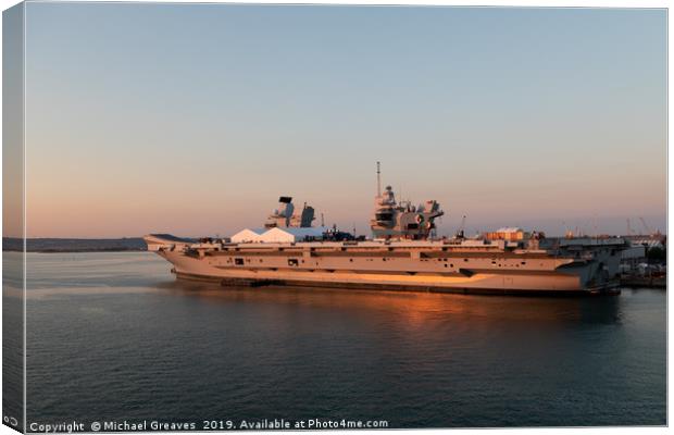 HMS Queen Elizabeth in Portsmouth at sunset Canvas Print by Michael Greaves