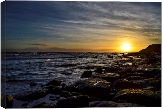 Sunrise by rocks Canvas Print by Thomas Richardson