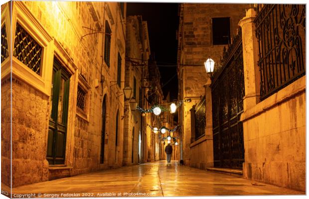 Night view of a narrow street in the historical center of Dubrovnik, Croatia Canvas Print by Sergey Fedoskin