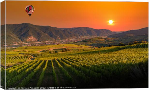 Colorful balloons flying over Wachau valley on a sunset. Austria Canvas Print by Sergey Fedoskin