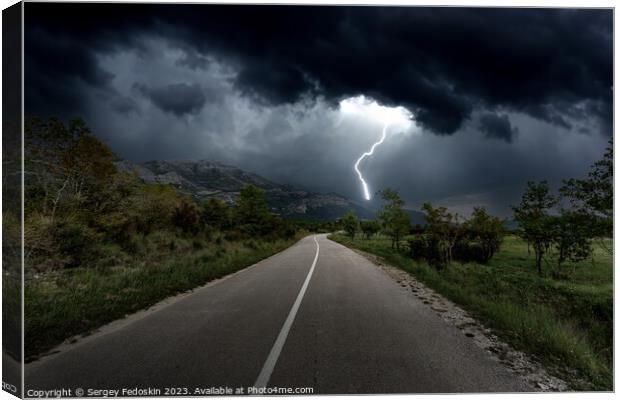 Lightning over mountains road Canvas Print by Sergey Fedoskin