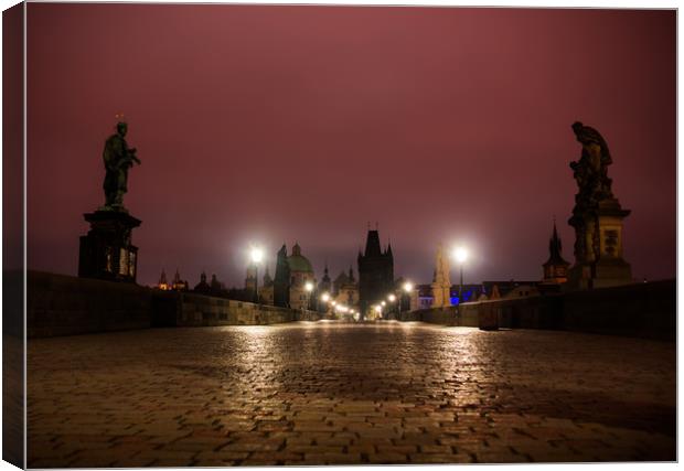 Charles bridge in Prague with lanterns at night Canvas Print by Sergey Fedoskin