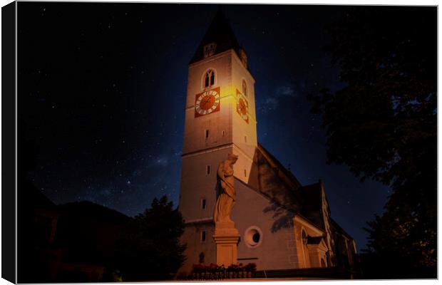A clock tower lit up at night. Spitz village. Wachau valley. Austria. Canvas Print by Sergey Fedoskin