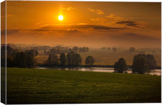 Sunset over field and forest. Canvas Print by Sergey Fedoskin