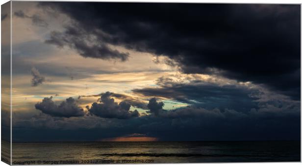 Coast of a sea and dramatic sky. Evening time. Stormy weather. Canvas Print by Sergey Fedoskin