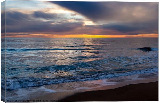 View of a sunset over a sea. Canvas Print by Sergey Fedoskin
