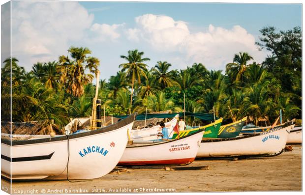 Wooden fishing boats on Morjim beach, Goa, India Canvas Print by Andrei Bortnikau