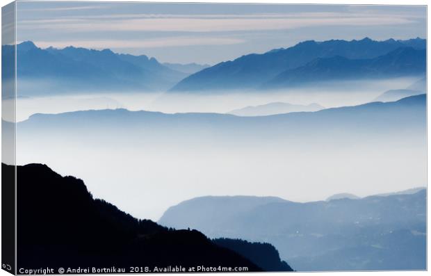 Misty mountains in Alps, Italy Canvas Print by Andrei Bortnikau