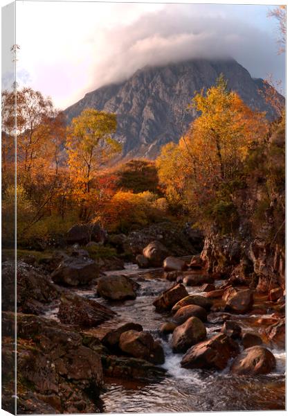 A waterfall with Buachaille Etive Mor in the background Canvas Print by Tony Bishop