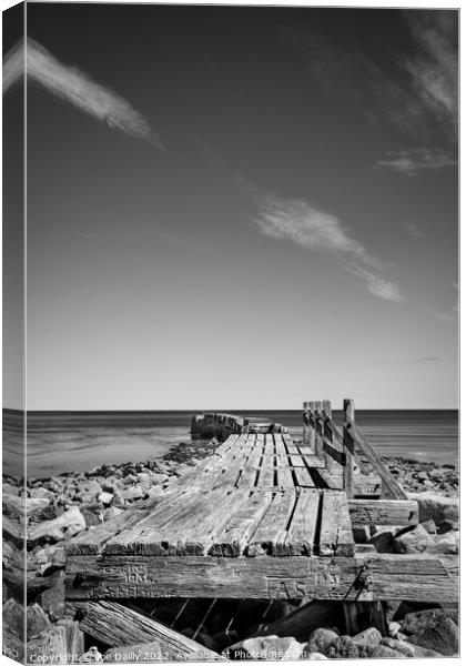 Old breakwater at Lossiemouth beach in Mono Canvas Print by Joe Dailly