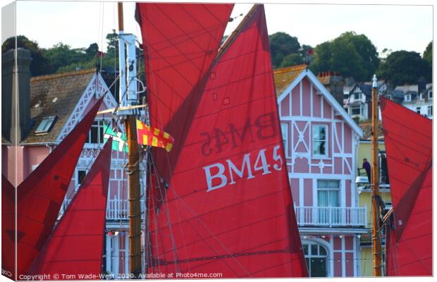 Red Sails Passing Dartmouth Waterfront Canvas Print by Tom Wade-West