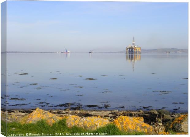 Udale Bay, RSPB reserve and oil rigs Canvas Print by Rhonda Surman