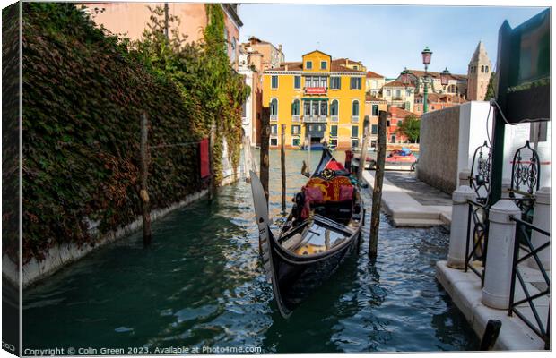 Gondola Parked in Venice Canvas Print by Colin Green